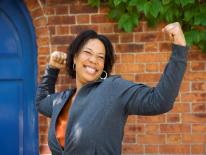 Peer Specialist Certification Program Woman with arms raised in triumph