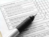 Picture of a form with a pen on top Picture of a form with a pen on top